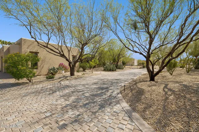 a view of a backyard with sitting area