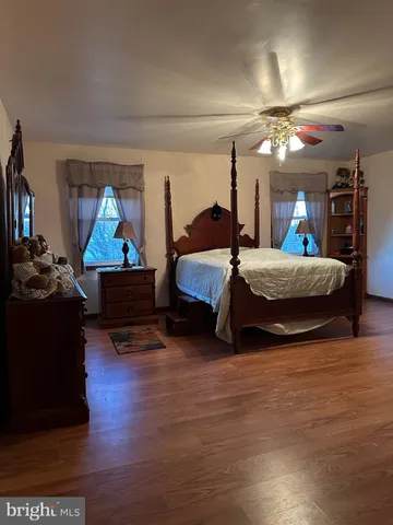 a living room with a bed and furniture