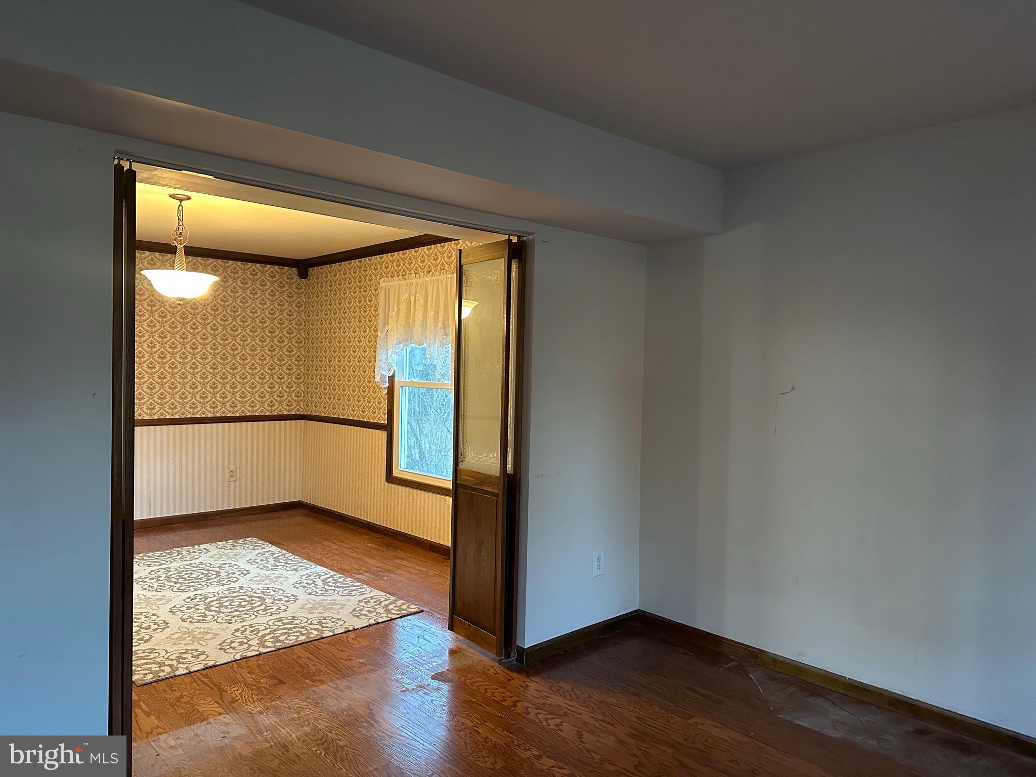 24 McIntosh Road Sewell, NJ 08080 - Photo 6 of 23 a view of a big room with wooden floor and windows