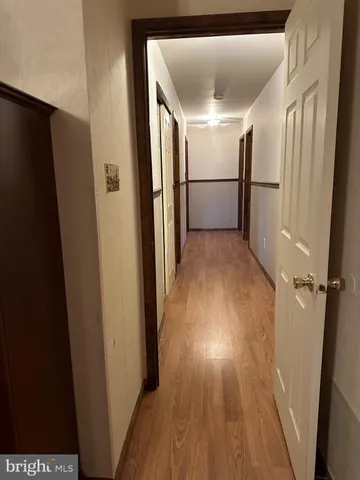 a view of entryway with wooden floor