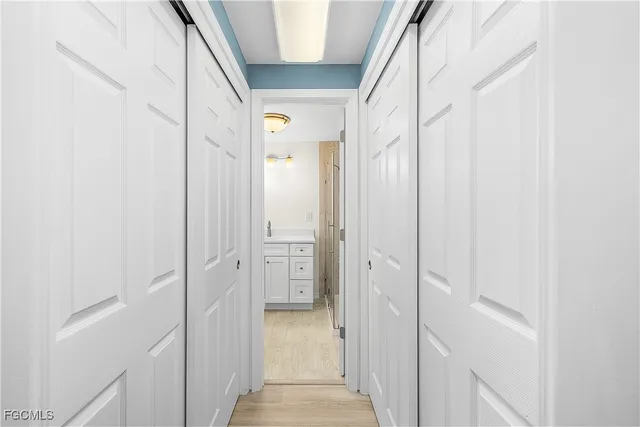 a bathroom with a shower sink and mirror