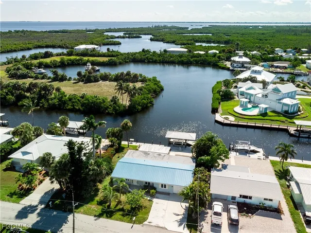an aerial view of a house with a lake view