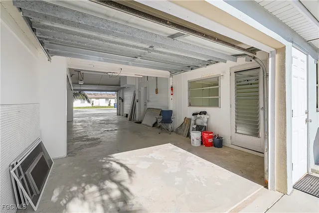 a view of a patio with chairs next to a yard