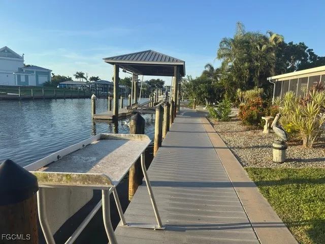 an aerial view of a city with lots of residential buildings lake and ocean view