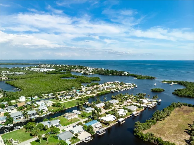 a front view of a house with a yard and a garage