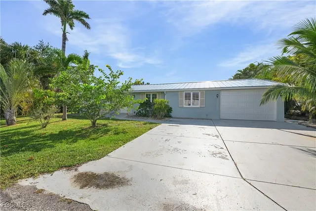 a aerial view of a house with outdoor space