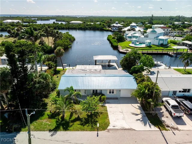 a aerial view of a house with a swimming pool