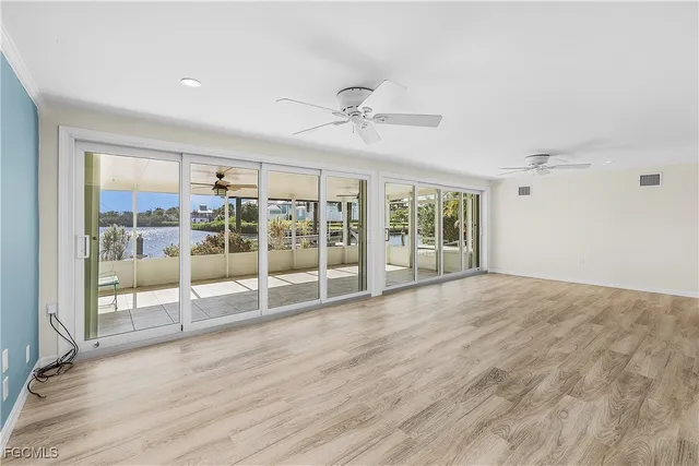 a view of an empty room with glass door