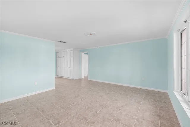 a view of an empty room and window