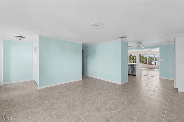 a kitchen with granite countertop a refrigerator stove and microwave