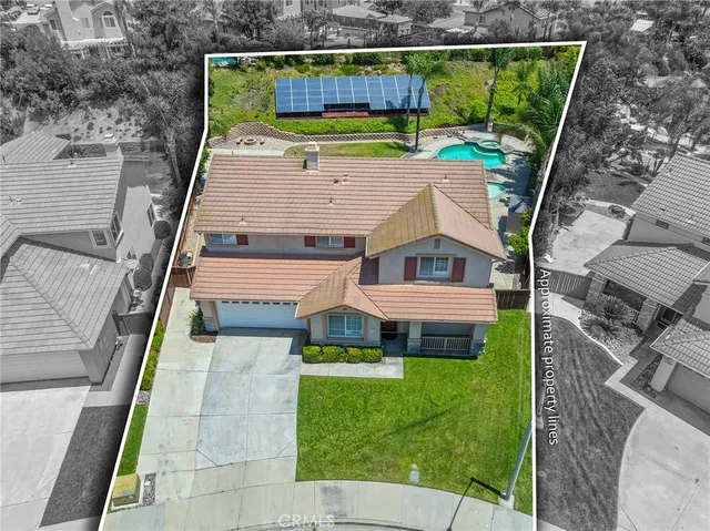 a aerial view of a house with a yard