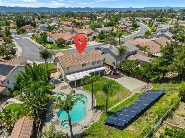 an aerial view of a house with a garden