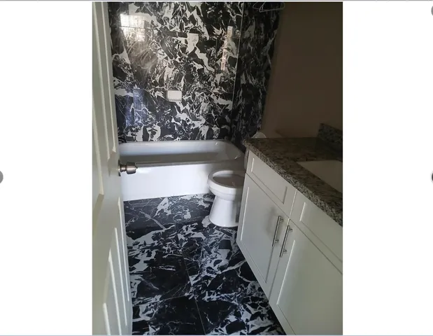 a bathroom with a toilet