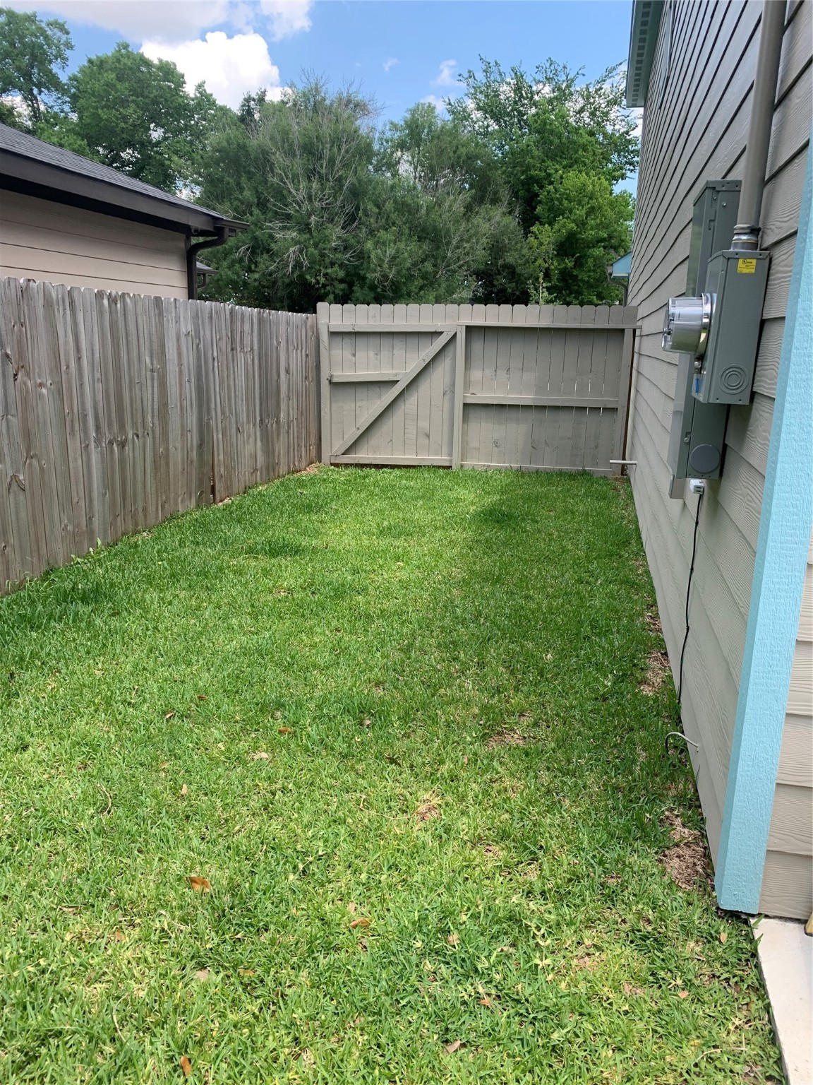 4122 Mallow Street, Unit B Houston, TX 77051 - Photo 10 of 11 a view of a backyard with wooden fence