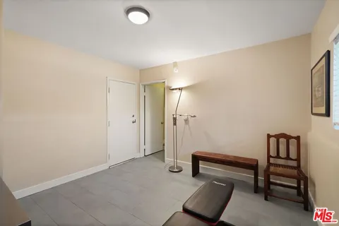 a view of a livingroom with furniture and cabinet