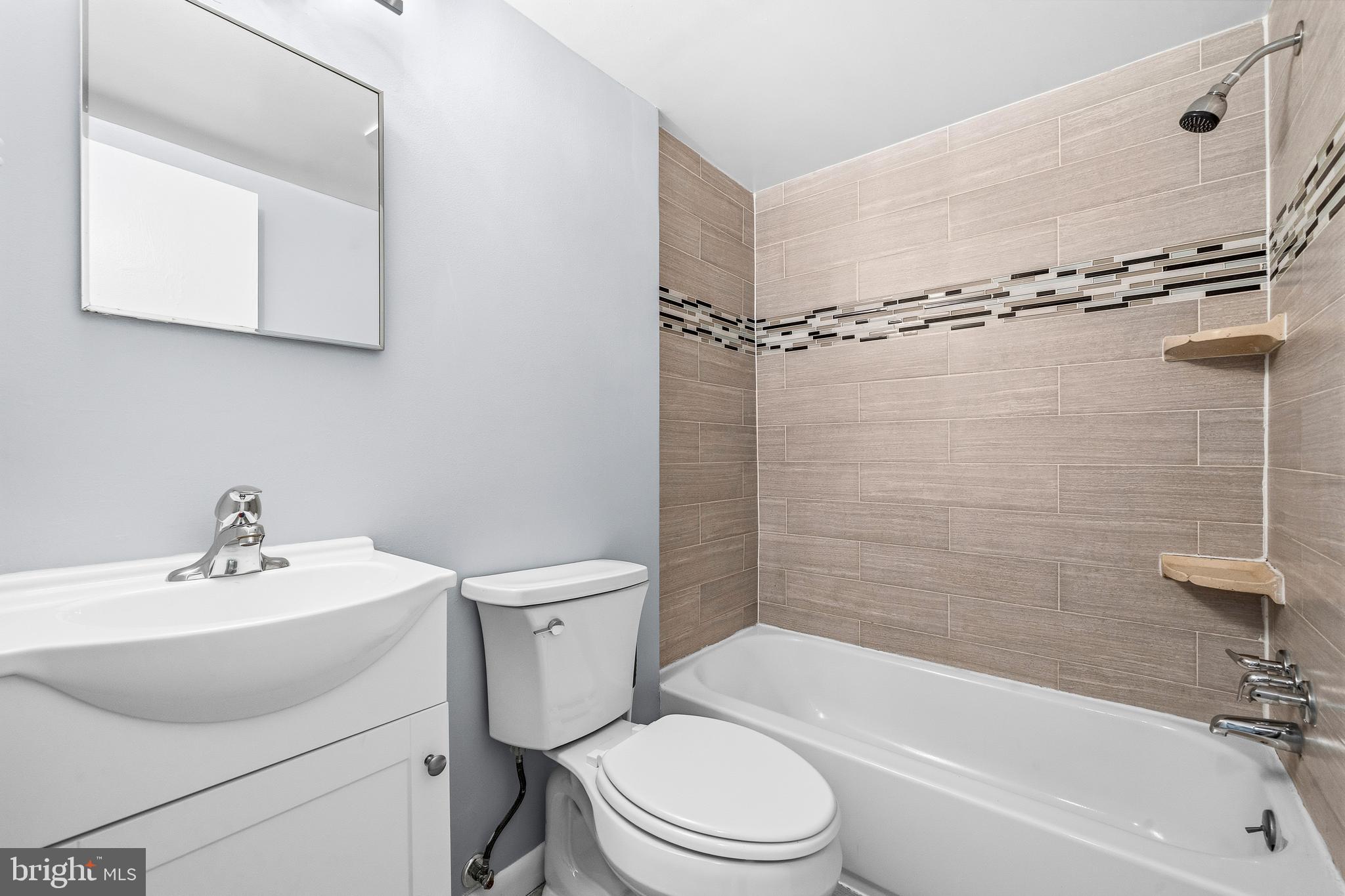 4260 Buckman Road, Unit 43 Alexandria, VA 22309 - Photo 20 of 35 a bathroom with a sink toilet and shower
