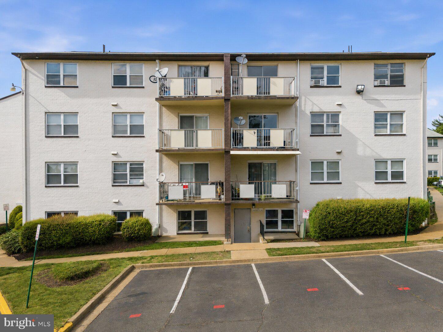 4260 Buckman Road, Unit 43 Alexandria, VA 22309 - Photo 34 of 35 a front view of a building with a garden