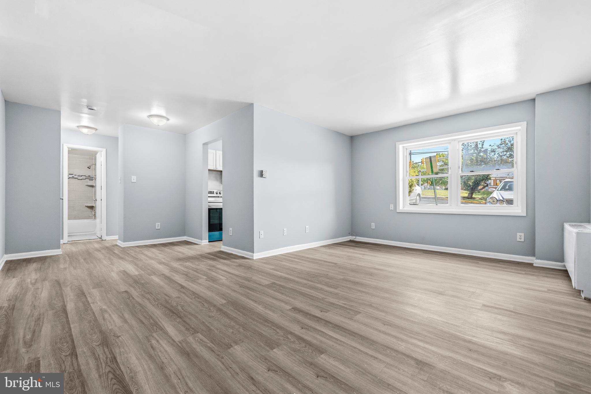 4260 Buckman Road, Unit 43 Alexandria, VA 22309 - Photo 5 of 35 a view of an empty room with window and wooden floor