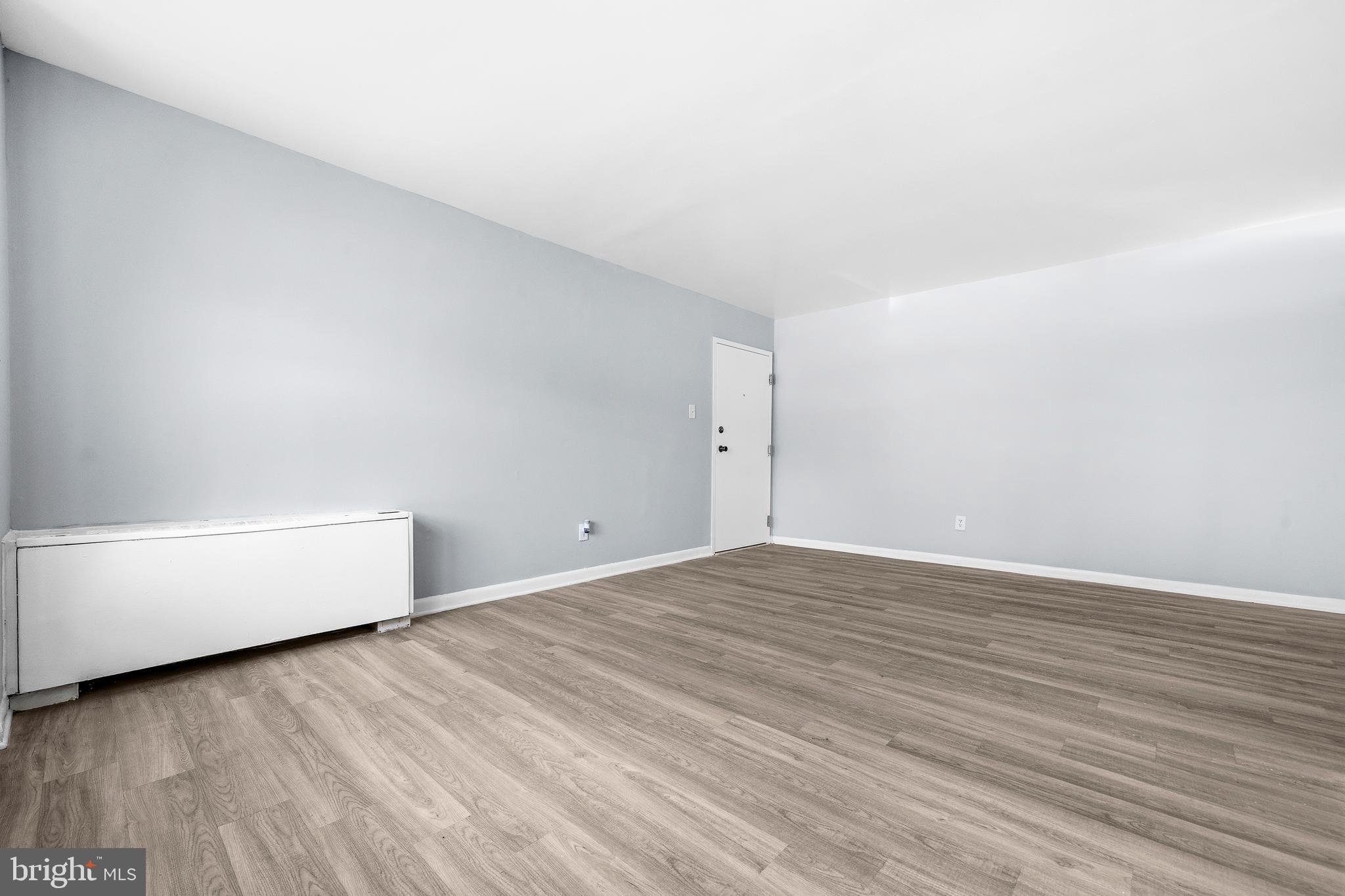 4260 Buckman Road, Unit 43 Alexandria, VA 22309 - Photo 8 of 35 a view of an empty room and wooden floor