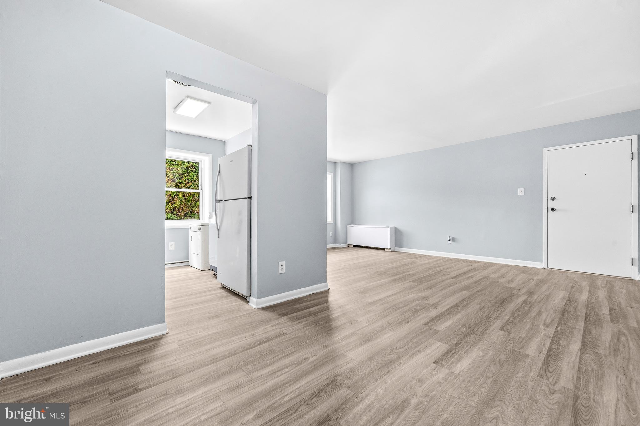 4260 Buckman Road, Unit 43 Alexandria, VA 22309 - Photo 9 of 35 an empty room with wooden floor & windows