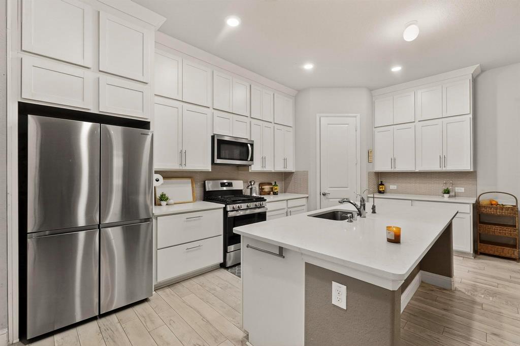 1027 Zachary Way Allen, TX 75013 - Photo 11 of 35 Large Center island can have bar stools, bright and open