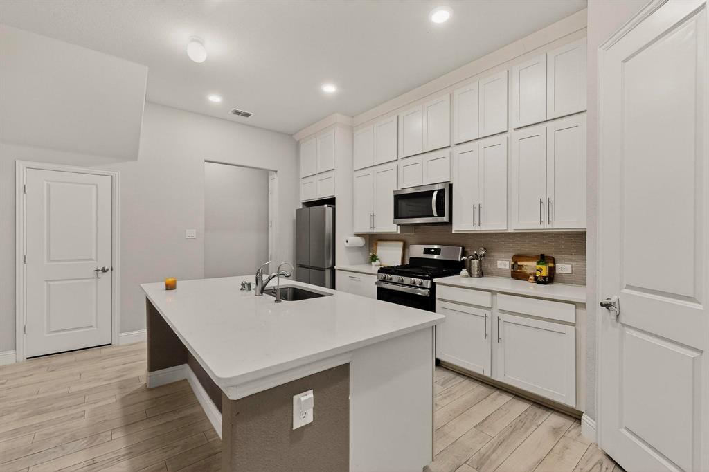 1027 Zachary Way Allen, TX 75013 - Photo 13 of 35 Large pantry & mud bench, new gas cooktop