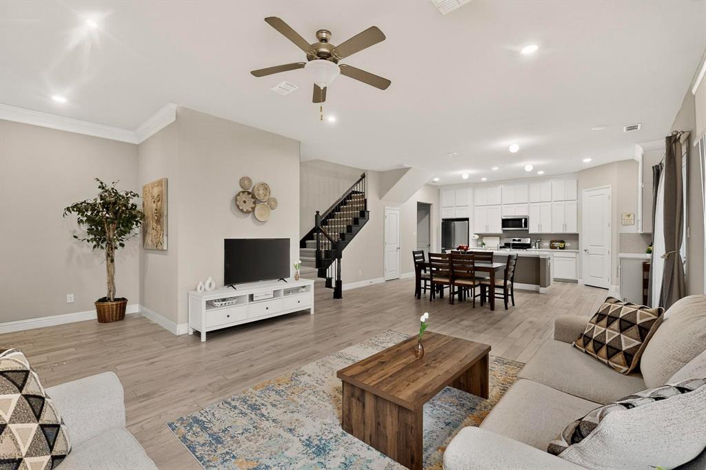 1027 Zachary Way Allen, TX 75013 - Photo 5 of 35 Spacious open concept living with wood-like tile