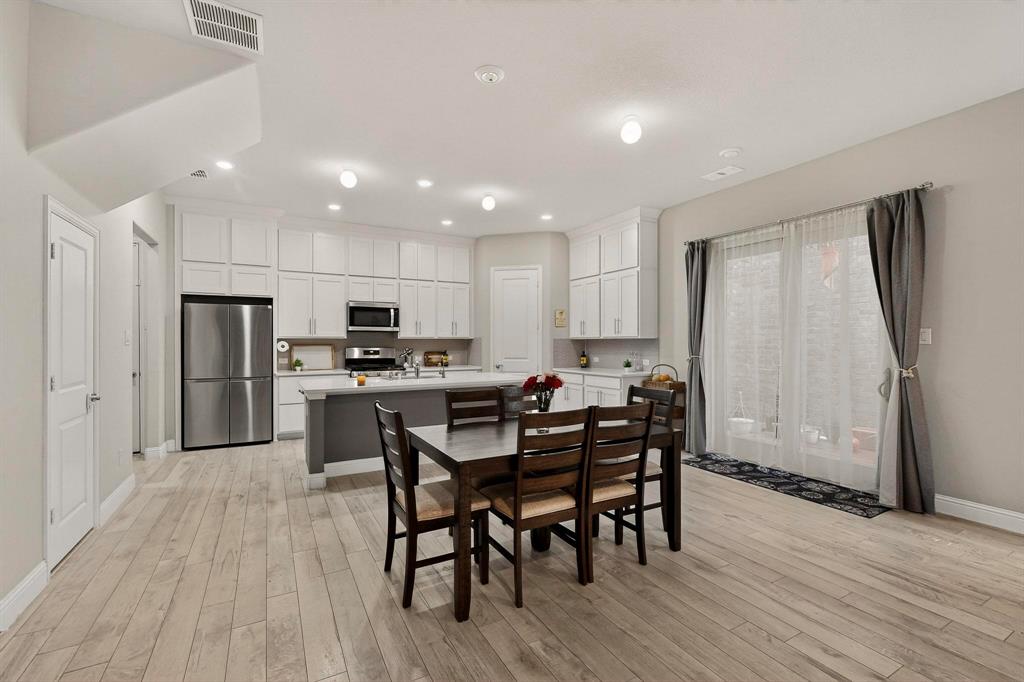 1027 Zachary Way Allen, TX 75013 - Photo 8 of 35 Beautiful sliding glass door with flowing white drapes