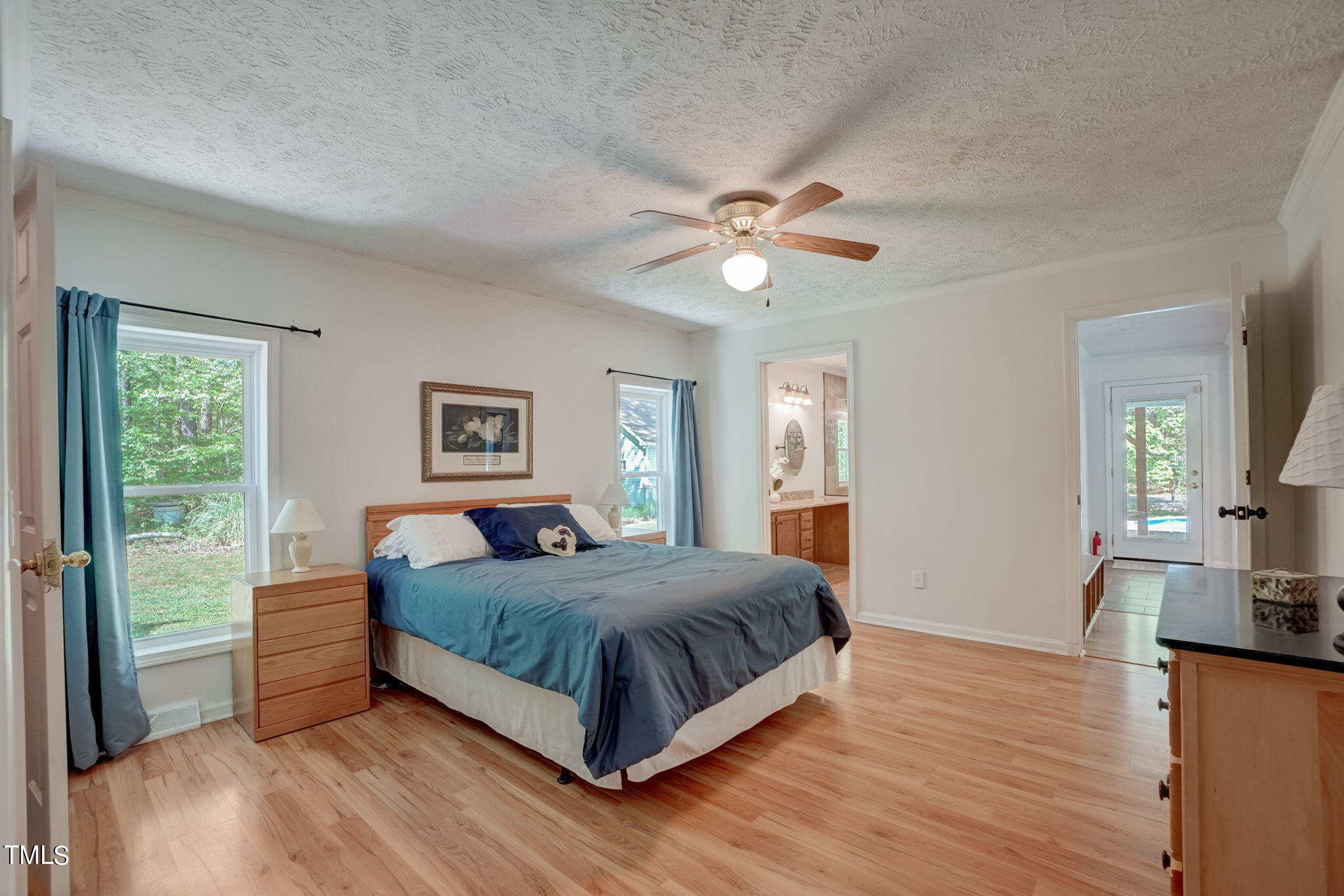 7204 New Sharon Church Road Rougemont, NC 27572 - Photo 13 of 48 a bedroom with a large bed and a chandelier