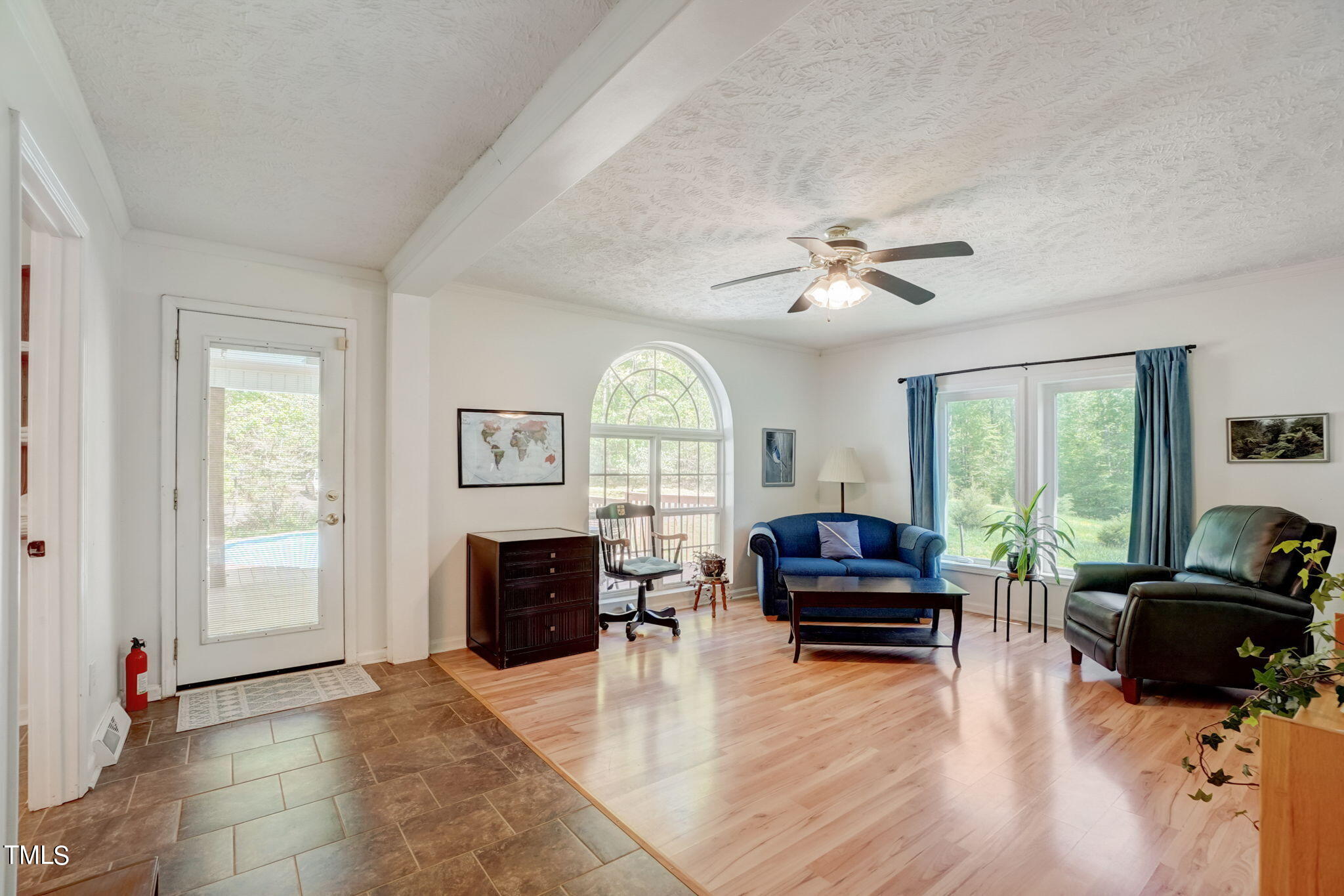 7204 New Sharon Church Road Rougemont, NC 27572 - Photo 24 of 48 a living room with furniture a fireplace and a large window
