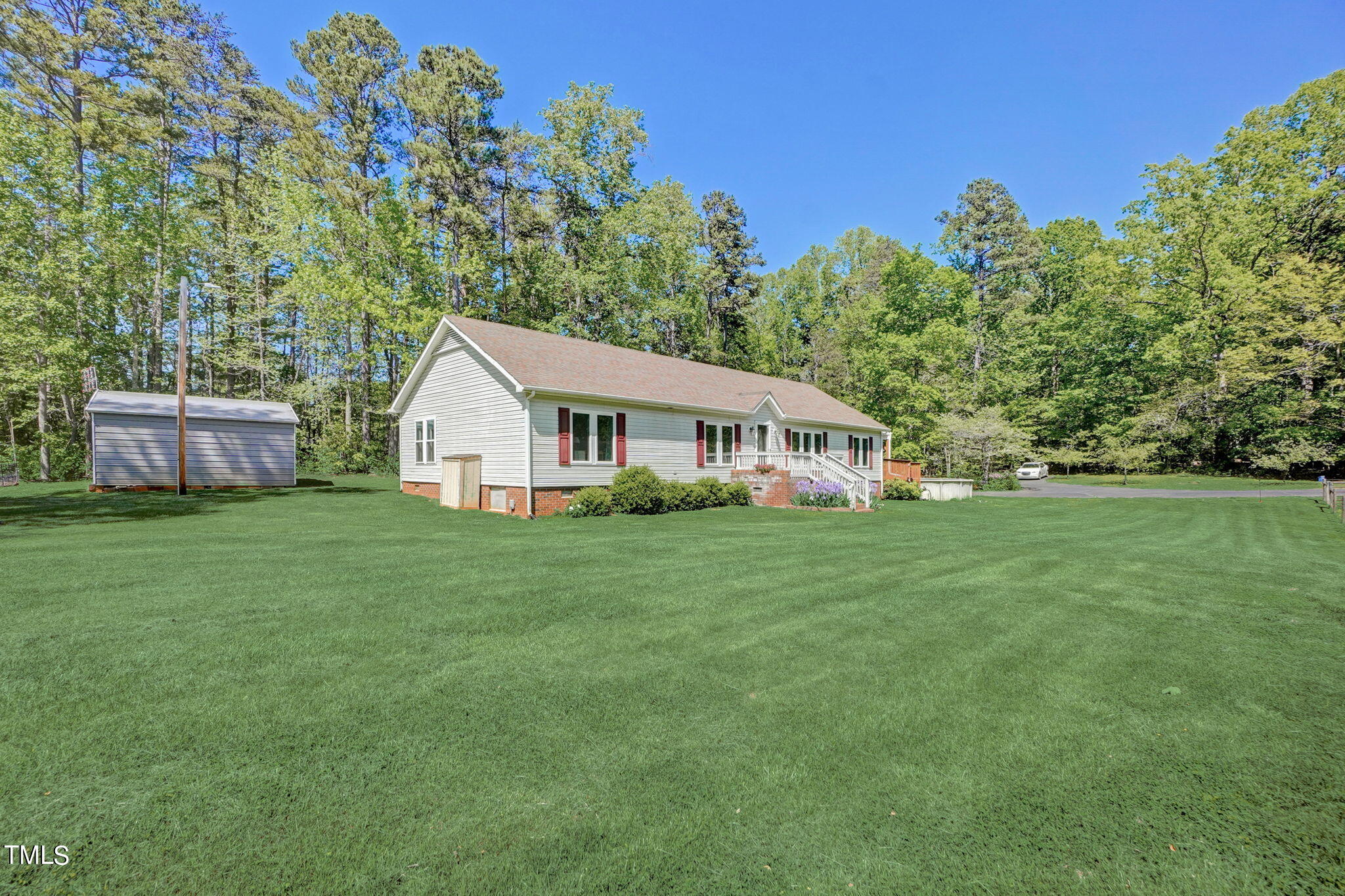 7204 New Sharon Church Road Rougemont, NC 27572 - Photo 3 of 48 a front view of a house with a garden