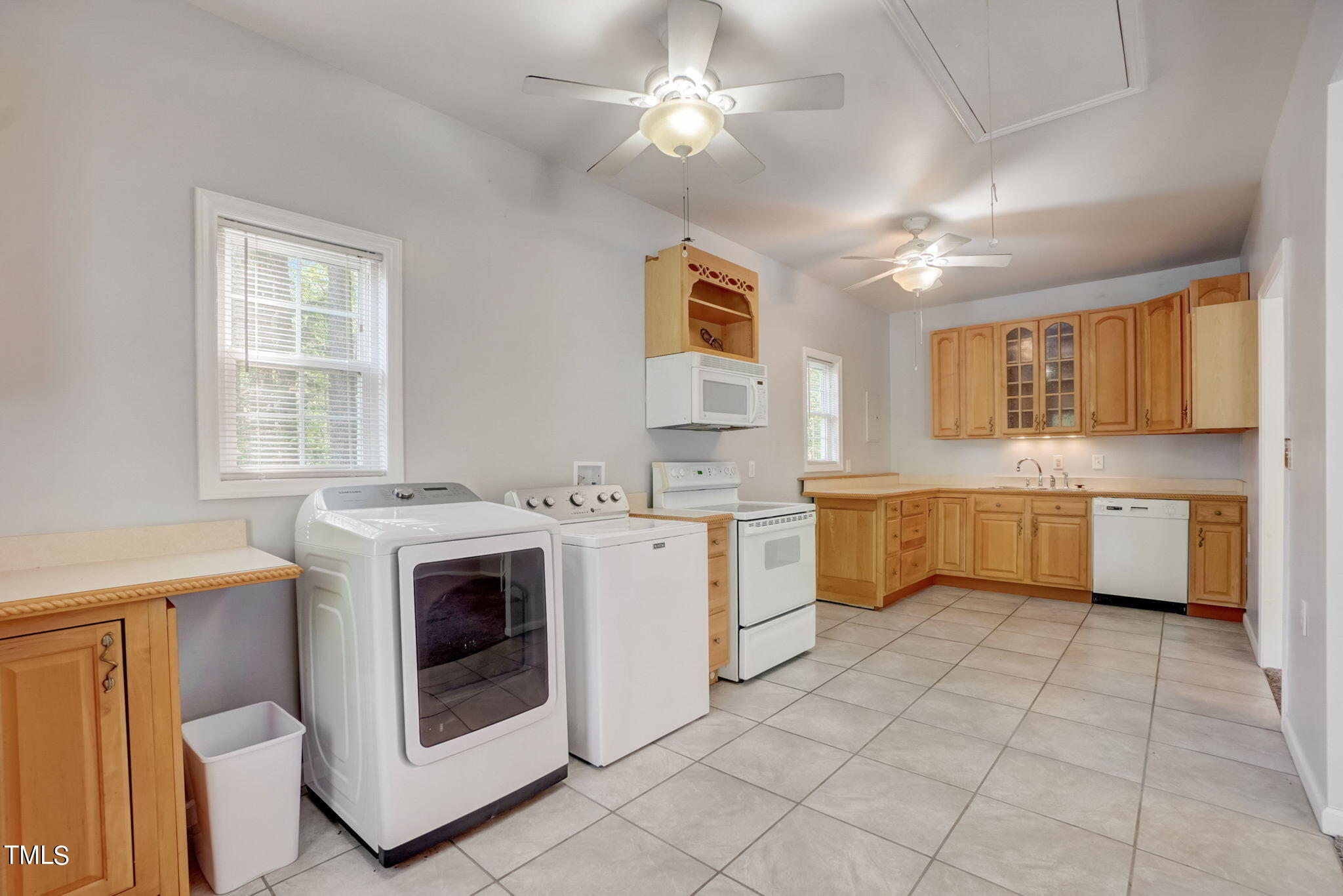 7204 New Sharon Church Road Rougemont, NC 27572 - Photo 36 of 48 a kitchen with a stove sink and cabinets