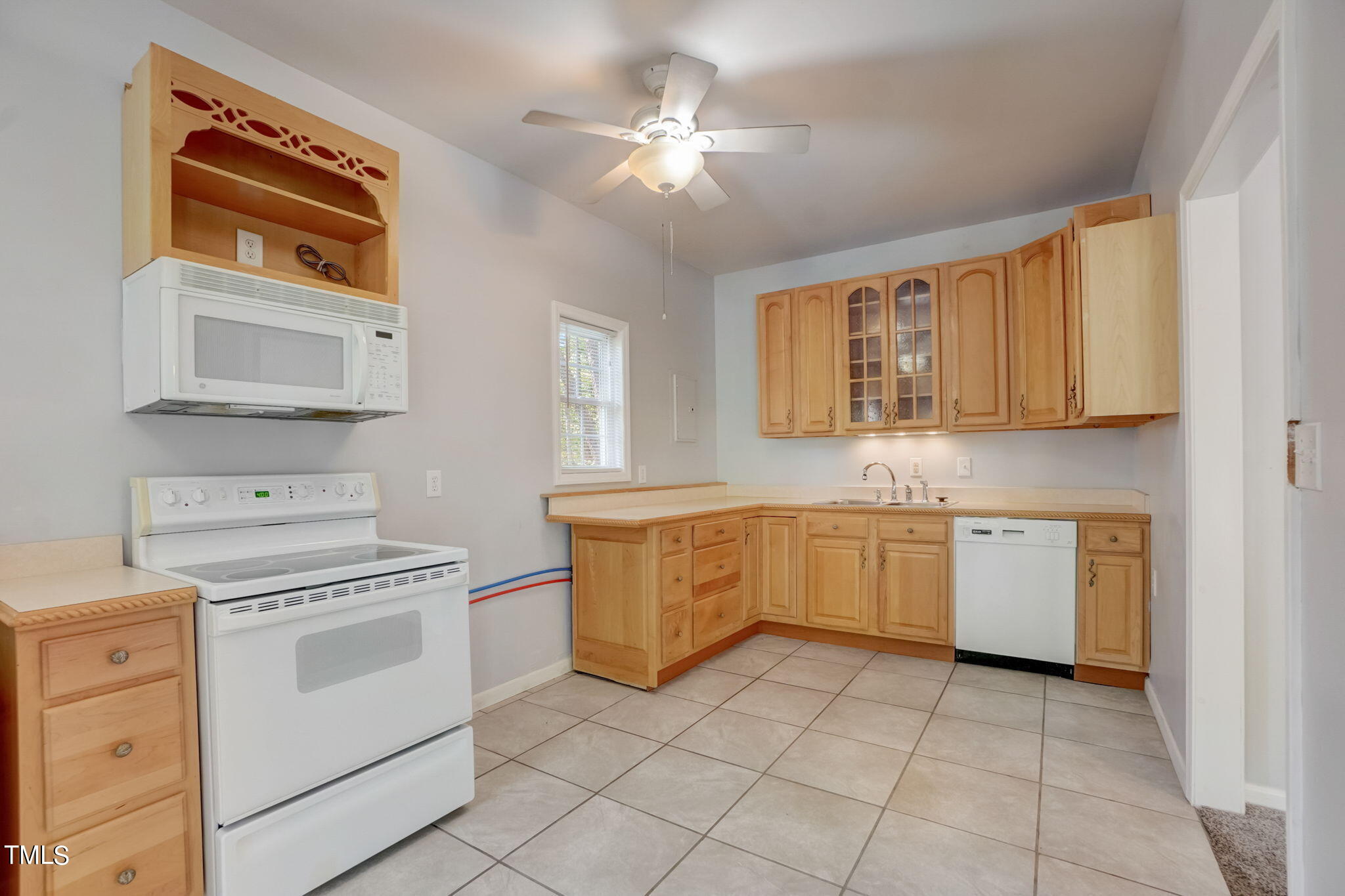 7204 New Sharon Church Road Rougemont, NC 27572 - Photo 37 of 48 a kitchen with a stove sink and cabinets
