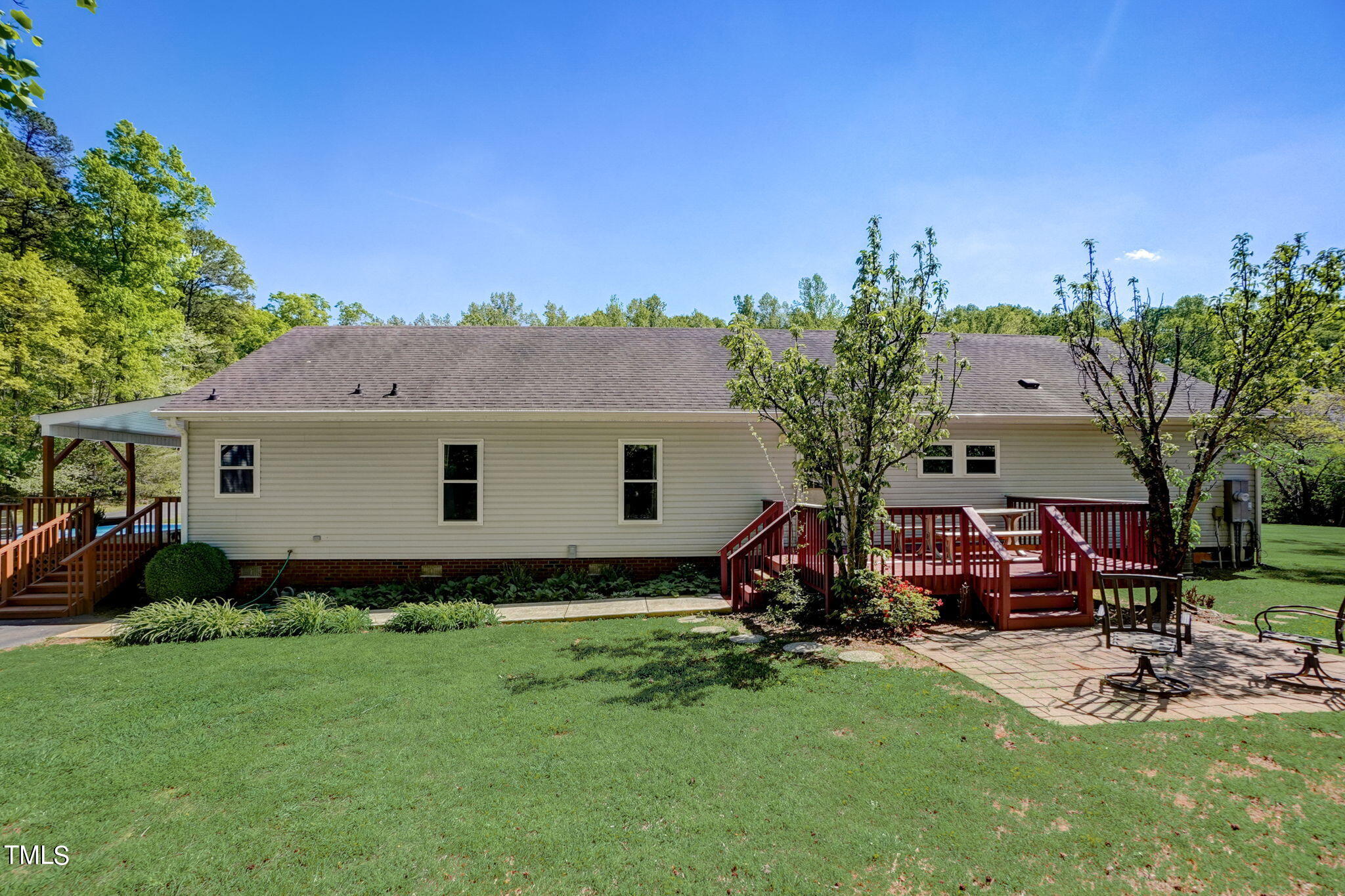 7204 New Sharon Church Road Rougemont, NC 27572 - Photo 44 of 48 a view of a backyard with plants and a patio