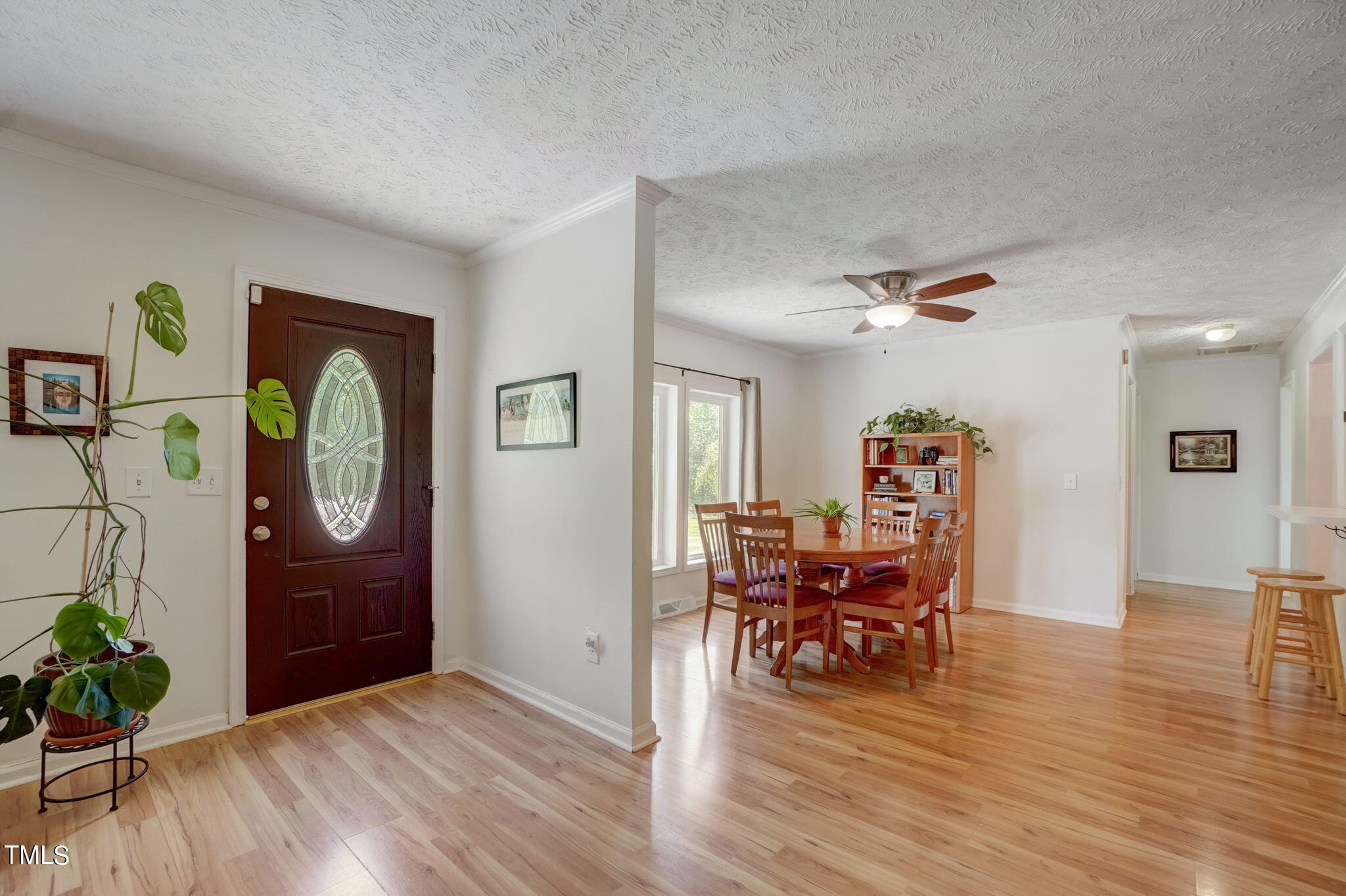 7204 New Sharon Church Road Rougemont, NC 27572 - Photo 5 of 48 a view of a livingroom and a dining room with furniture wooden floor a chandelier