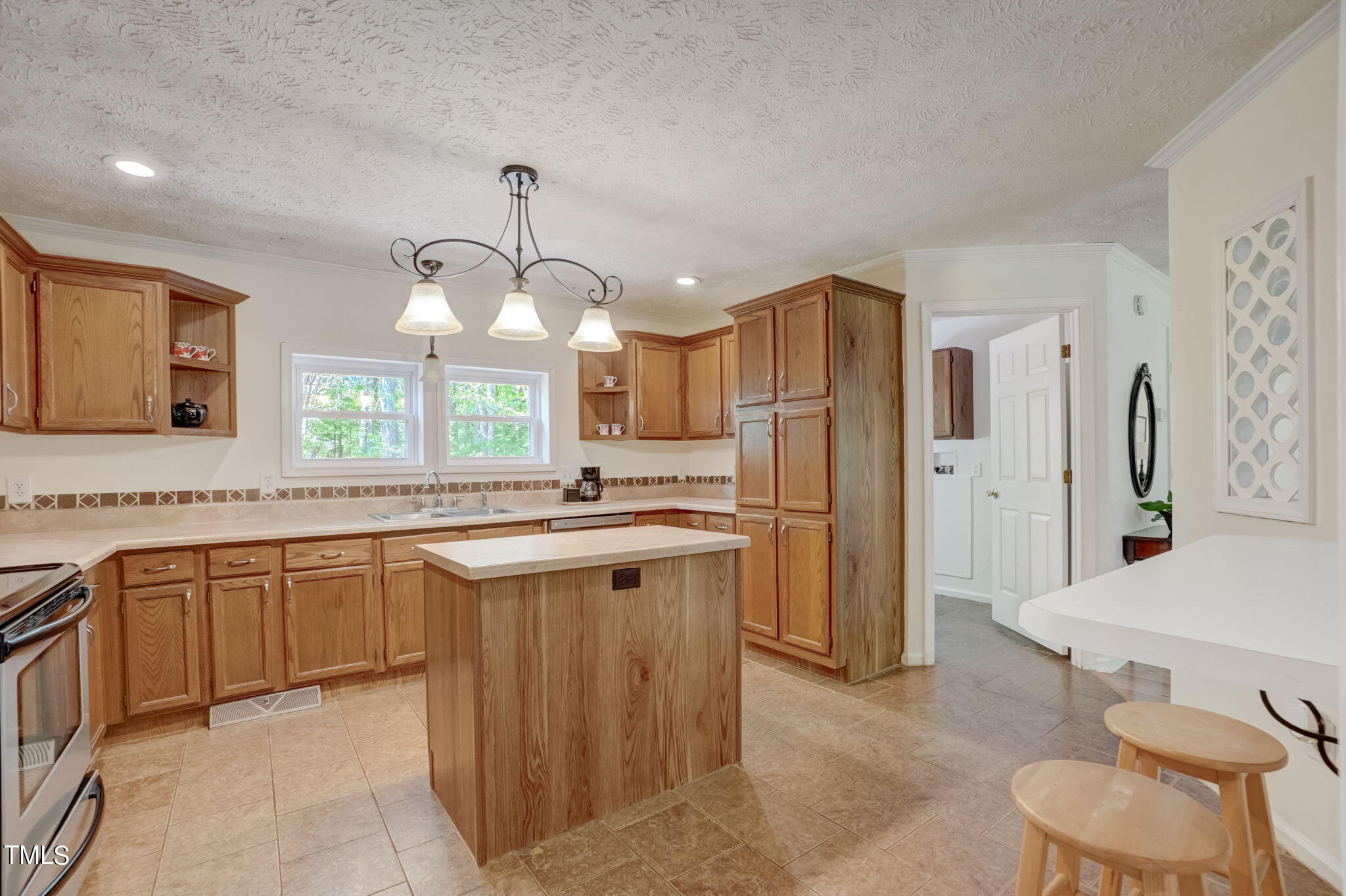 7204 New Sharon Church Road Rougemont, NC 27572 - Photo 9 of 48 a large kitchen with a sink stainless steel appliances and cabinets