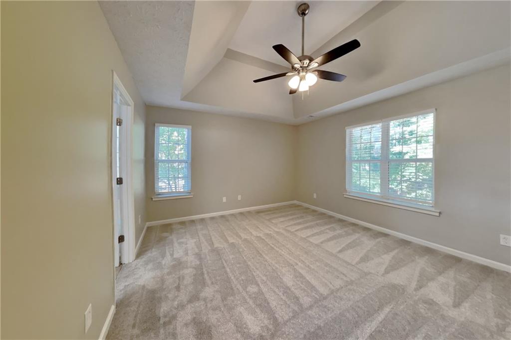 3366 English Oaks Drive Northwest Kennesaw, GA 30144 - Photo 11 of 22 a view of empty room with window and ceiling fan