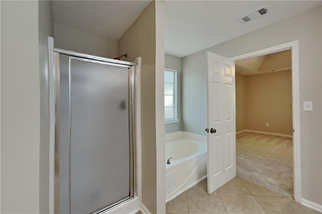 3366 English Oaks Drive Northwest Kennesaw, GA 30144 - Photo 13 of 22 a bathroom with a tub shower and a sink