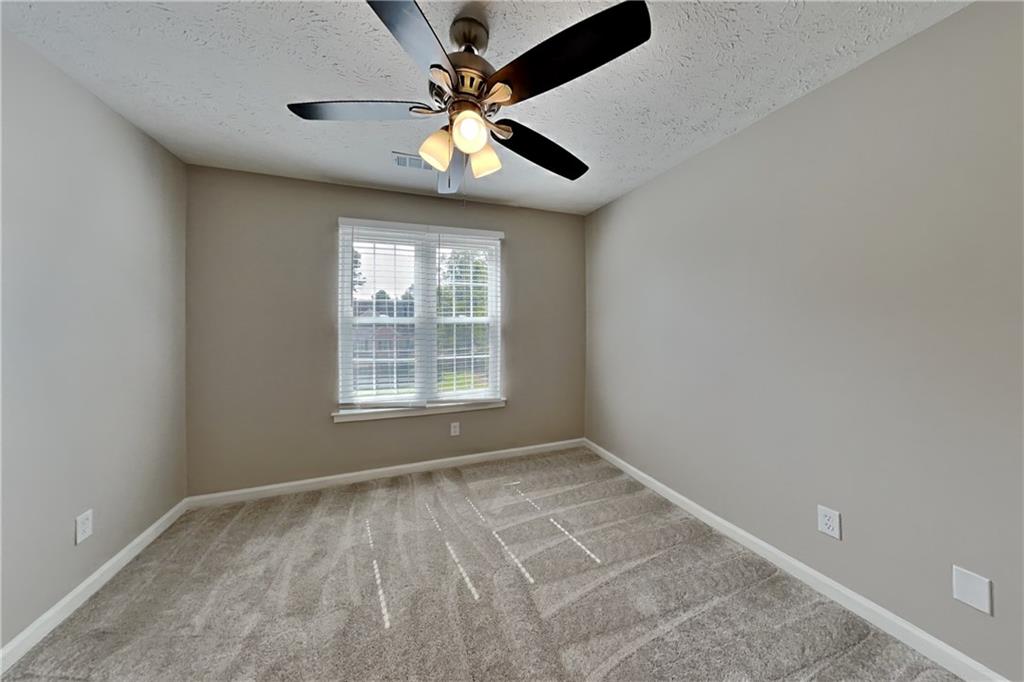 3366 English Oaks Drive Northwest Kennesaw, GA 30144 - Photo 15 of 22 a view of an empty room with a window