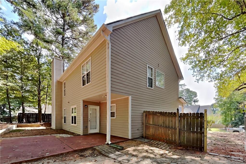 3366 English Oaks Drive Northwest Kennesaw, GA 30144 - Photo 19 of 22 a view of a house with a small yard