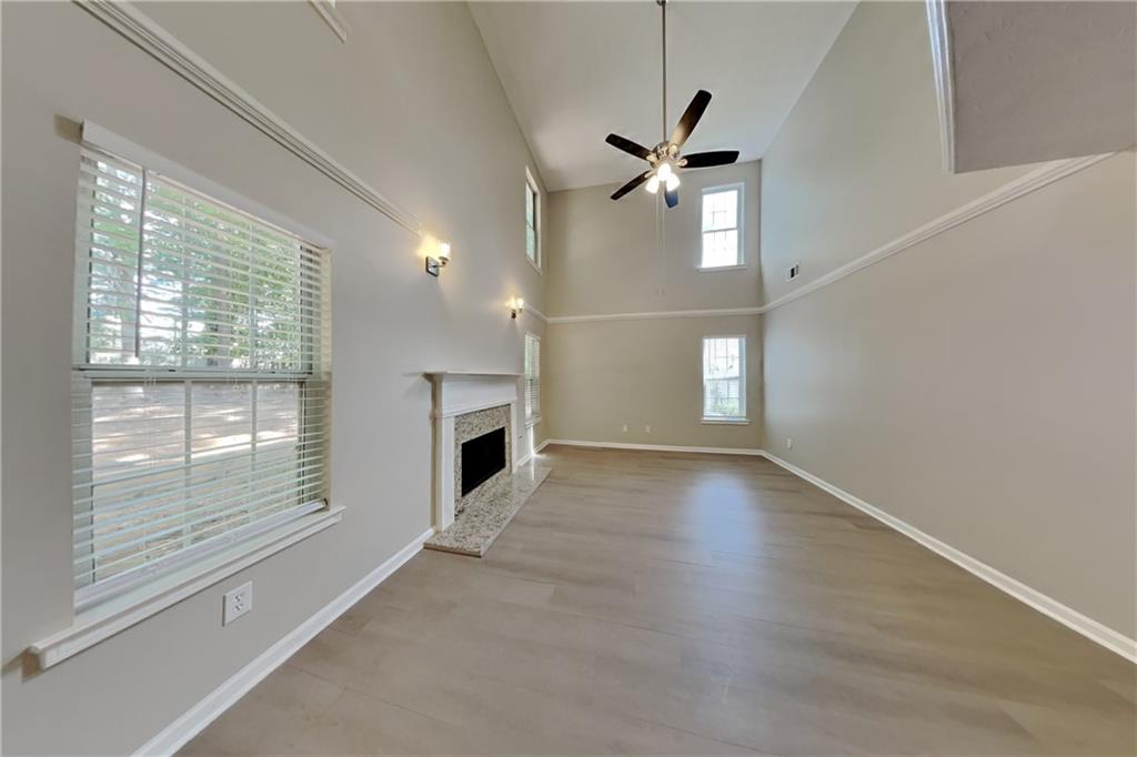 3366 English Oaks Drive Northwest Kennesaw, GA 30144 - Photo 2 of 22 a view of empty room with wooden floor and fan
