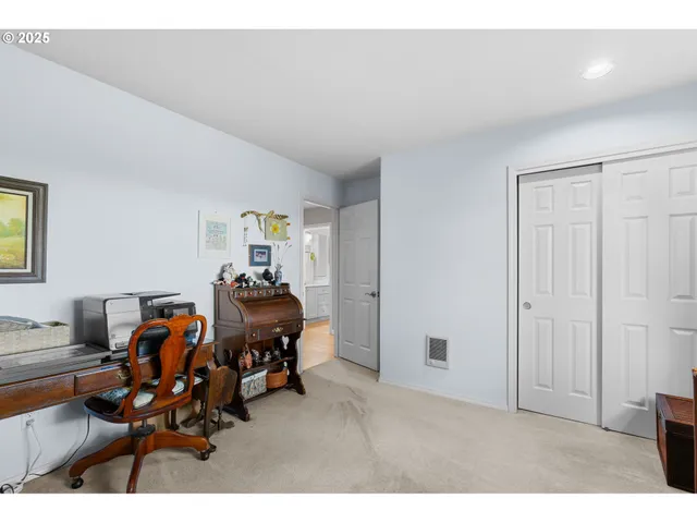 a living room with furniture and gym equipment