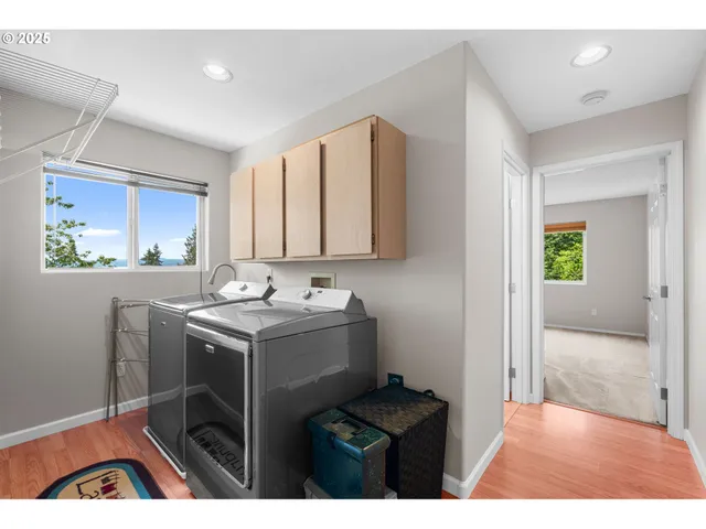 a utility room with sink dryer and washer