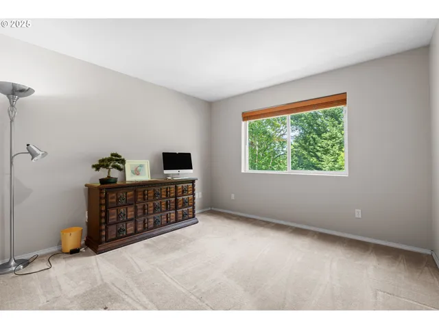 a view of workspace with furniture and window