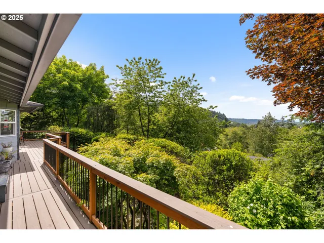 a view of balcony with wooden floor