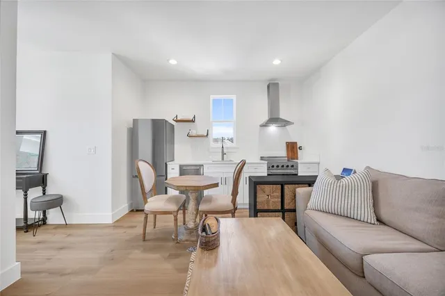 a view of a house with a yard and sitting area