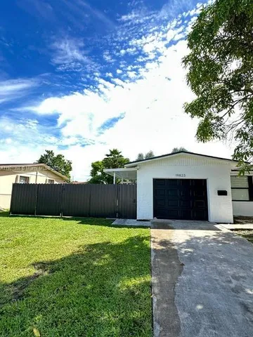 a view of a backyard with a small cabin