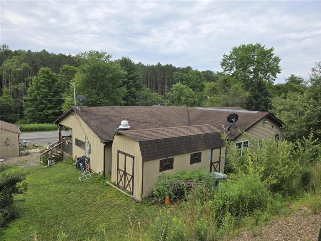 2879 Winslow Hill Road Benezett, PA 15821 - Photo 3 of 24 an aerial view of house with yard and trees in the background