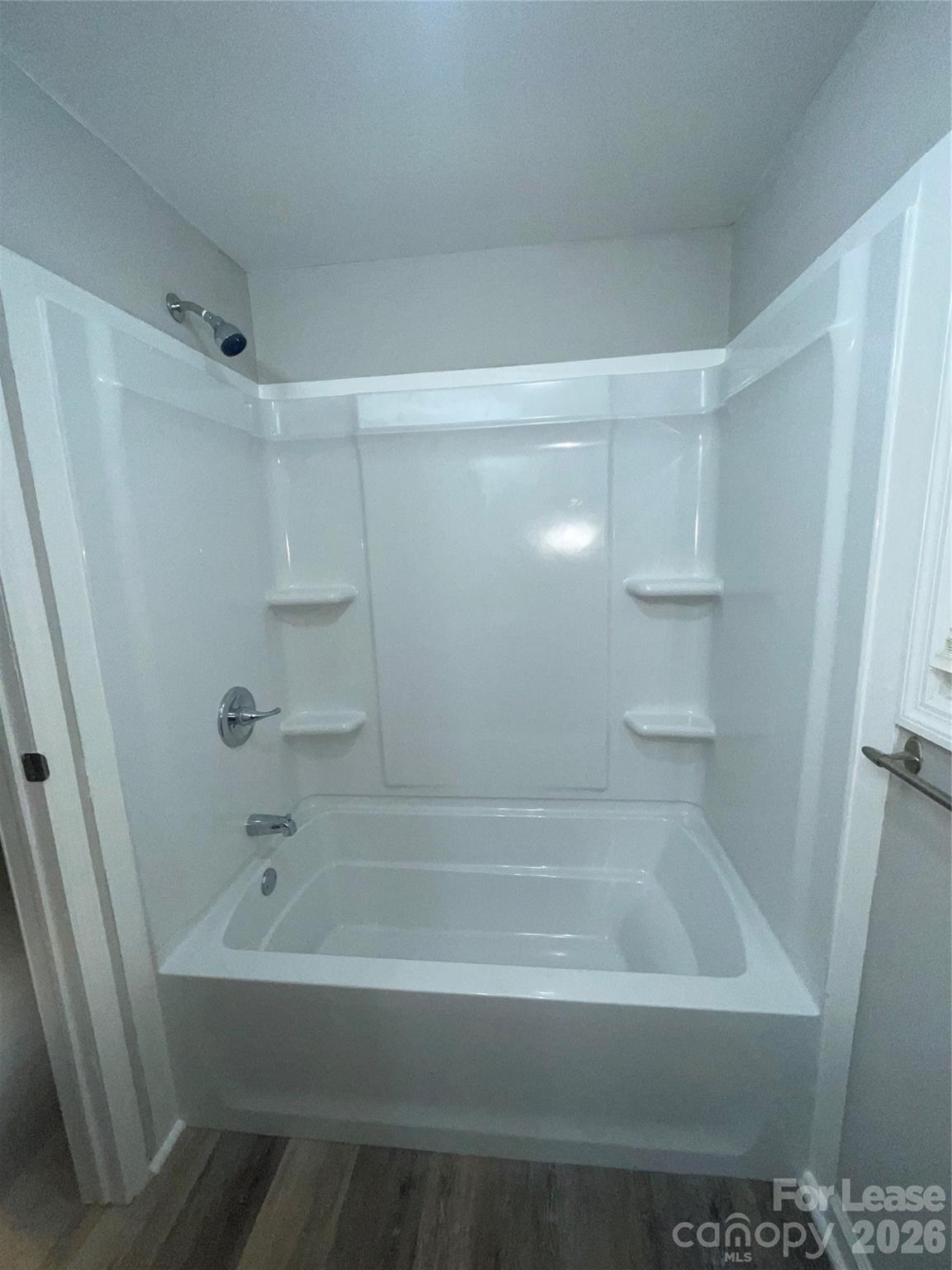 70 Barbee Road Southwest Concord, NC 28027 - Photo 3 of 7 a bathroom with a bathtub