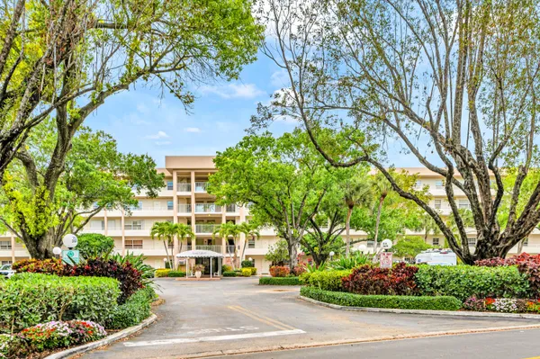 a view of a building with a garden